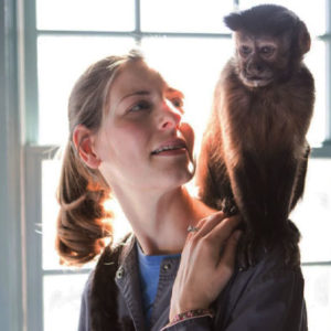 Big love, lLittle helpers - monkey sitting on trainer's shoulder