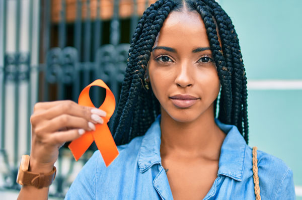 Helping Hands on Real Talk MS - girl holding MS ribbon.