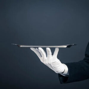 gloved hand holding a tray